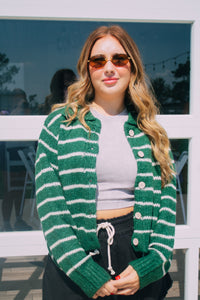 Green button up sweater